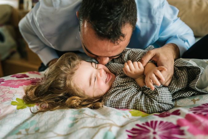 Father playing with daughter