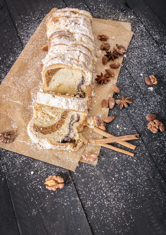 Top view of sponge cake with powdered sugar and spices