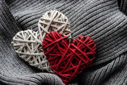 Thatched heart decorations on grey sweater