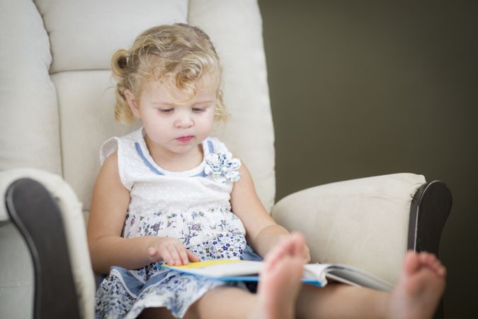 Blonde Little Girl Reading Her Book