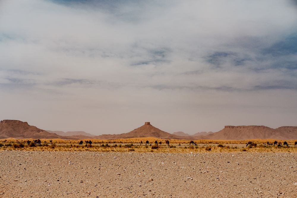 Sunset sky over hills in desert
