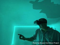 Man wearing VR headset in green lit room 4mwOv0