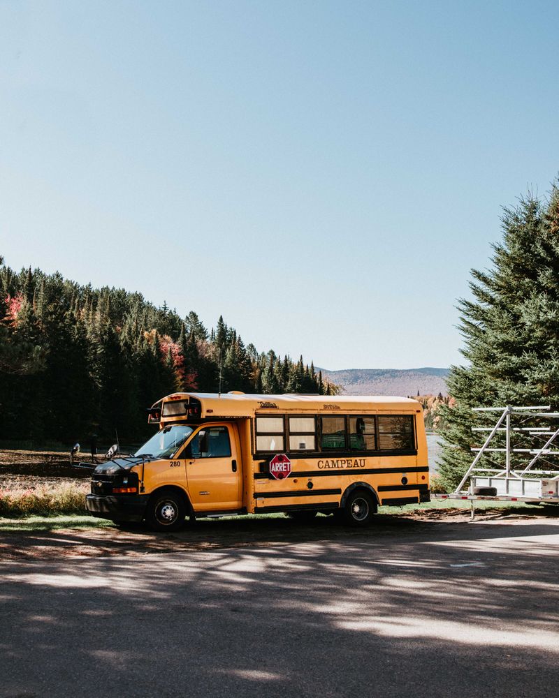 Yellow school bus on road during daytime