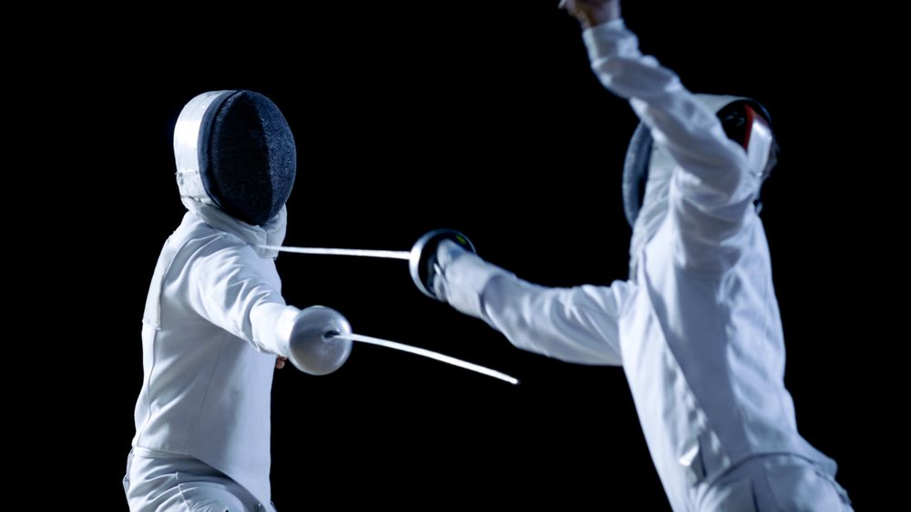 Two Professional Fencers Show Masterful Swordsmanship in their Foil Fight.