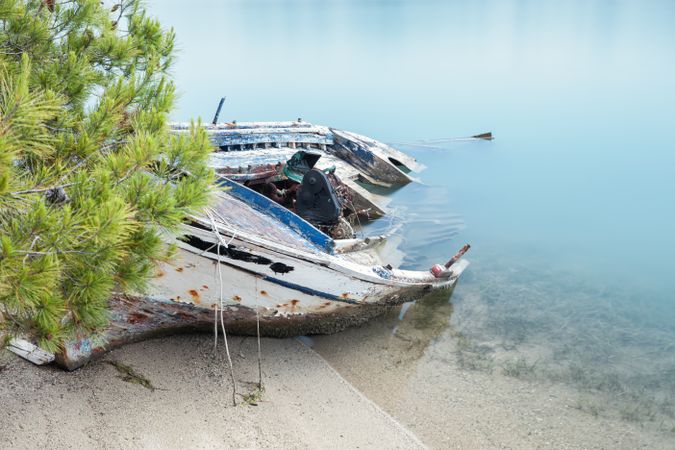 Old rusty boat in misty water