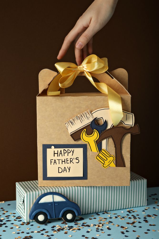 Father's day concept, gifts and greetings, on a brown background.