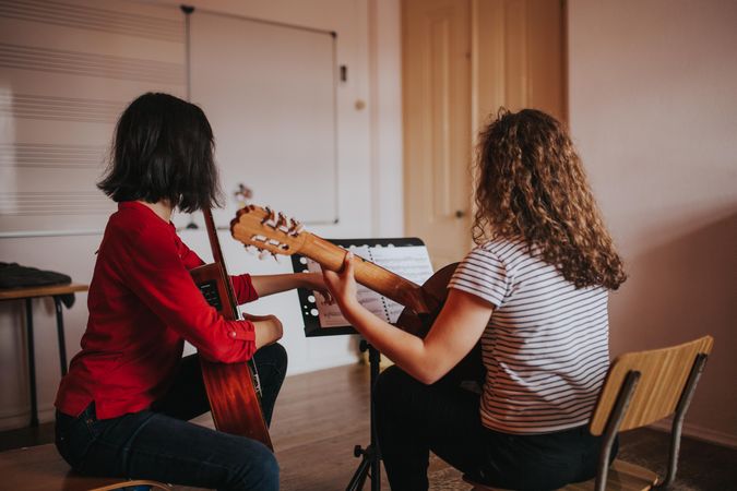 Two female students working on a duet in band practice