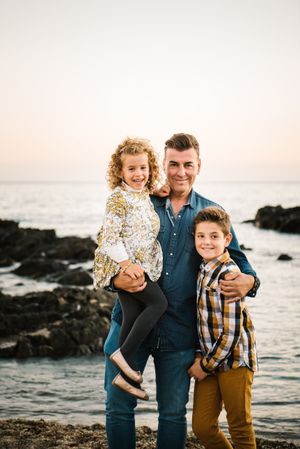 Father with her children at beach
