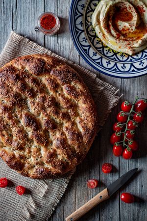 Ramazan pidesi near spices and tomatoes