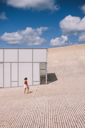 Woman next to contemporary building