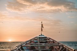Old boat floating in sea