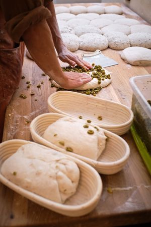 Leavened bread dough in the moulds resting to be baked.