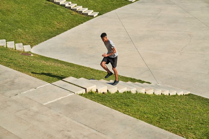 Sportsman running upstairs during workout