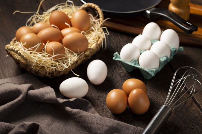 Chicken eggs go up on the table.