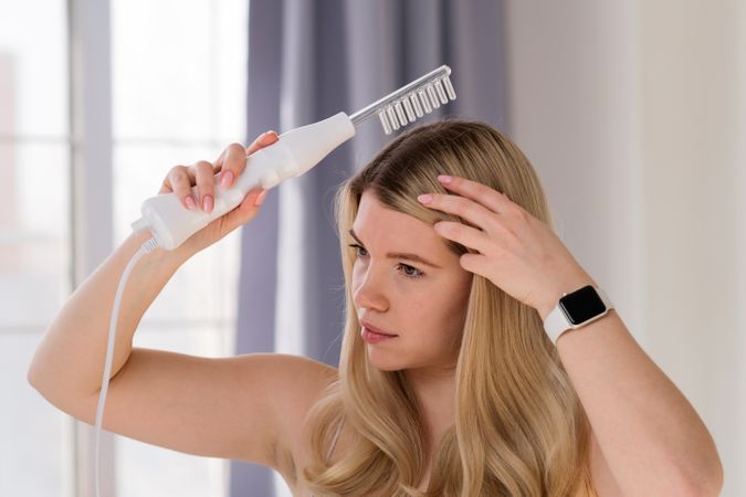 Enjoying microcurrent hair therapy.