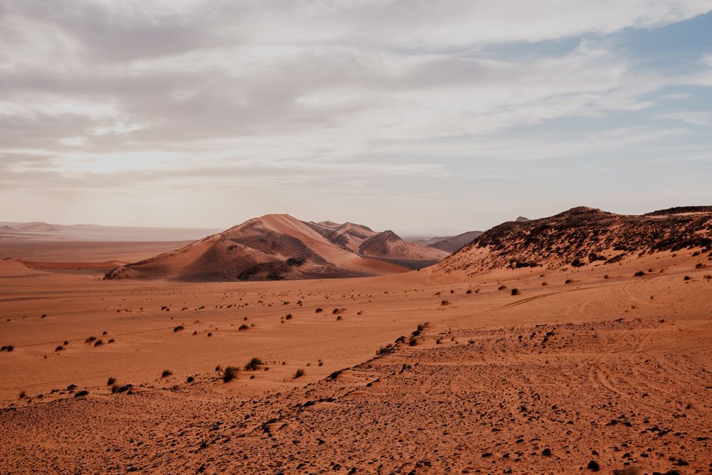 Sunset sky over hills in desert