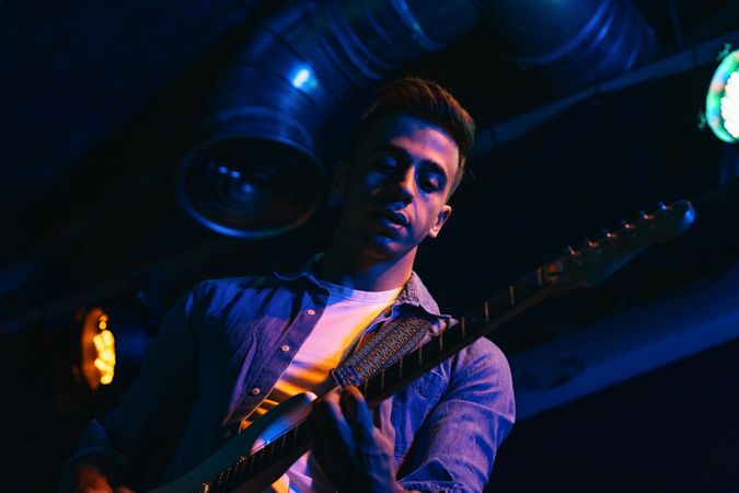 Rock Guitarist In Concert Hall Stage