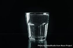 Single glass of water in dark room 5pdvA5
