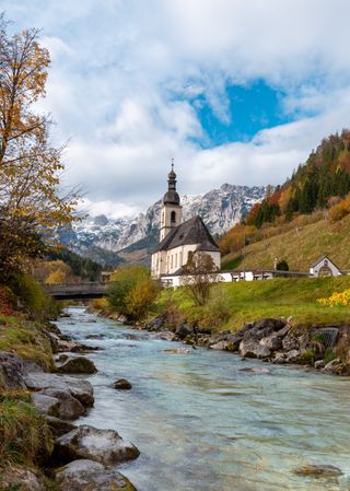Alpine scenery in the Bavarian Alps on a sunny day of autumn with church St. Sebastian