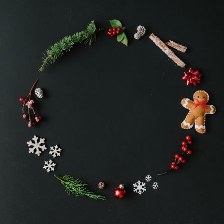 Christmas wreath made of winter items on dark background