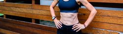 Female athlete in front of a wooden background