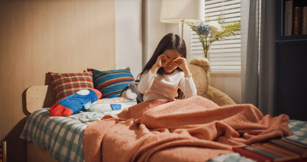 Adorable Young Korean Girl Waking Up in Her Cozy Room After a Good Night Sleep.