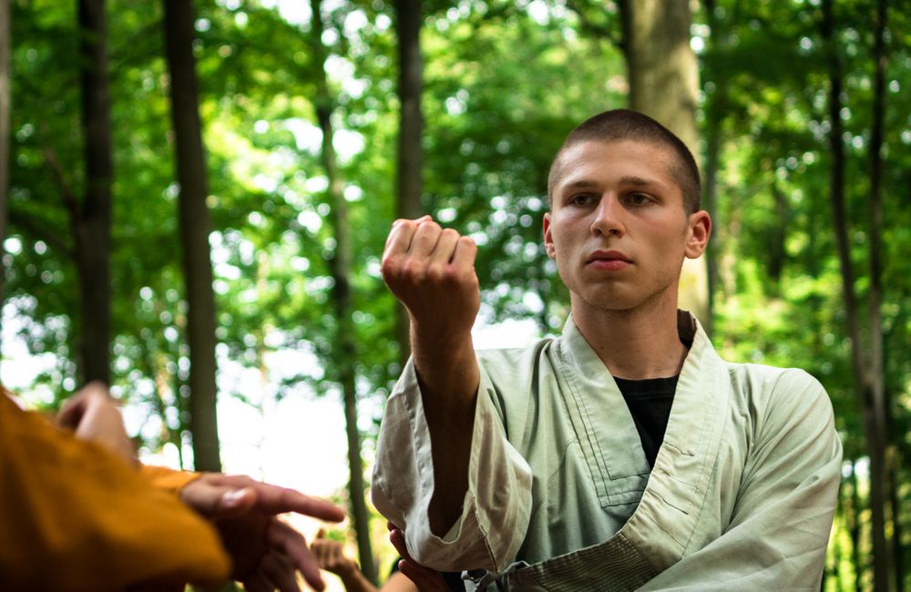woman practicing martial arts in garden