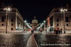 People walking on sidewalk near Adrian Park in Rome, Italy during night time 4jAwJ5