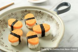 Plate of tamago, Japanese egg sushi on plate with space for text 5zOqA4