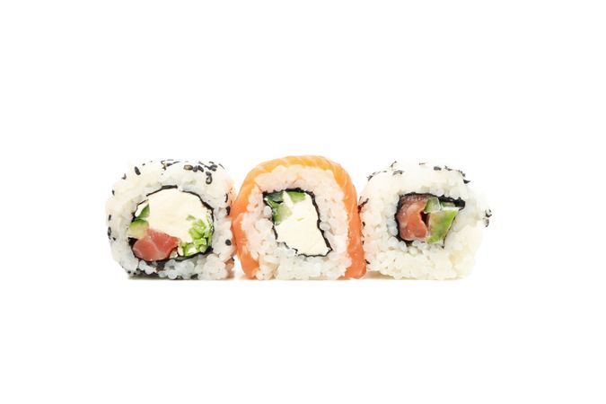 Japanese food. Delicious sushi rolls isolated on light background
