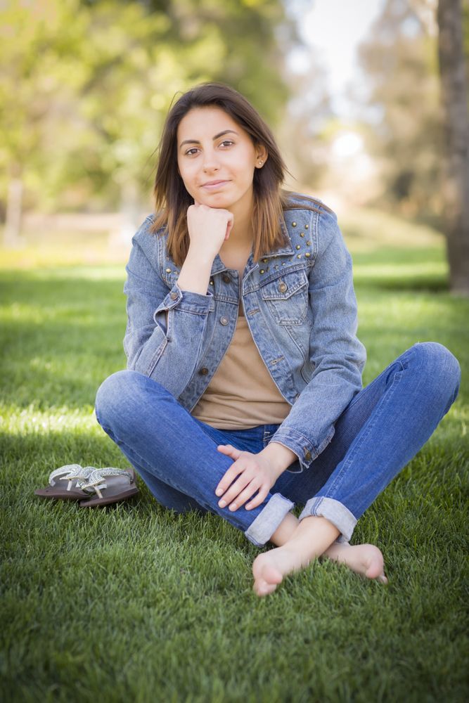 Iranian Young Woman Sitting in the Park