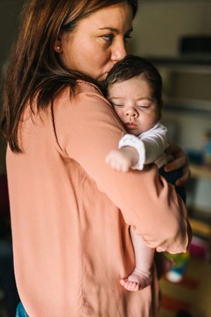 Mother holding baby in arms