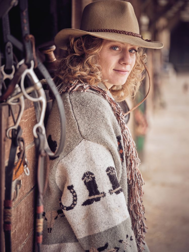 Stylish fair haired female in cowboy wear