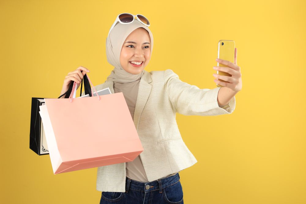 Young Asian Woman Selfie While Showing Off Her Paper Bag