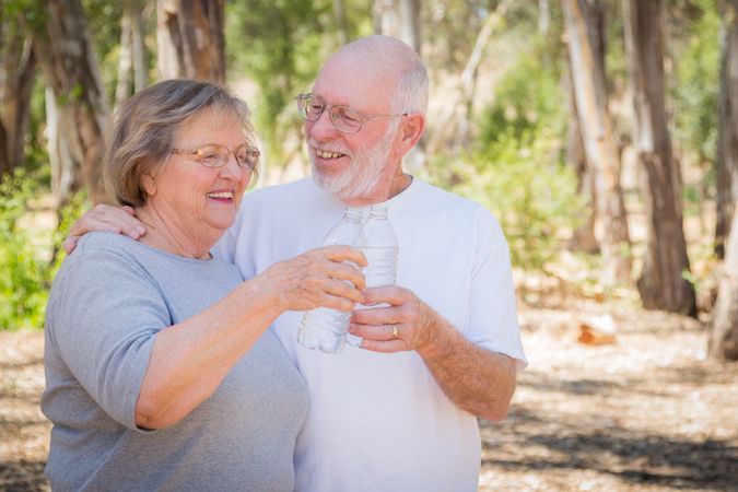 Happy Healthy Mature Couple with Water Bottles