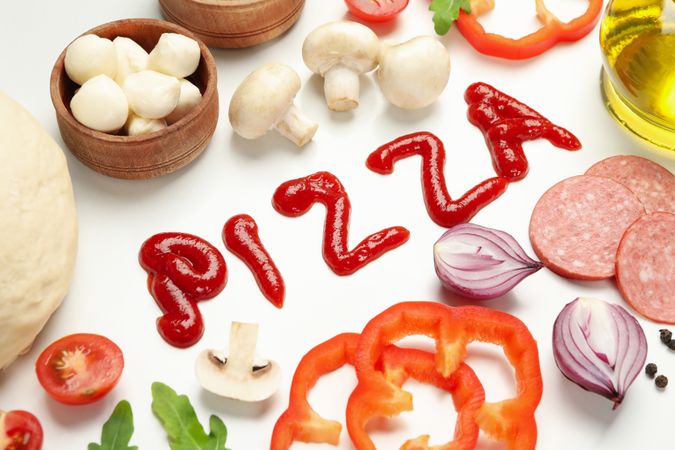 Inscription Pizza and ingredients for cooking on blank background