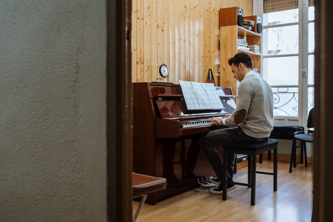 Man playing piano in studio