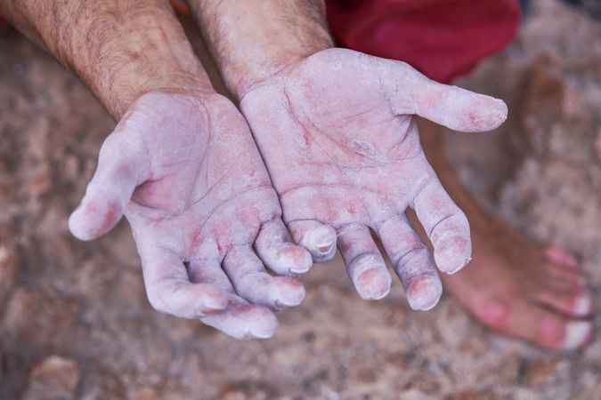 Scratched and dusted hands of crop person