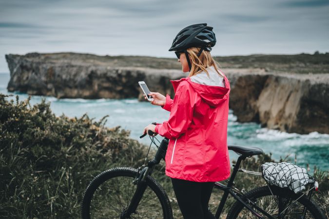 Female taking photos on cliffs