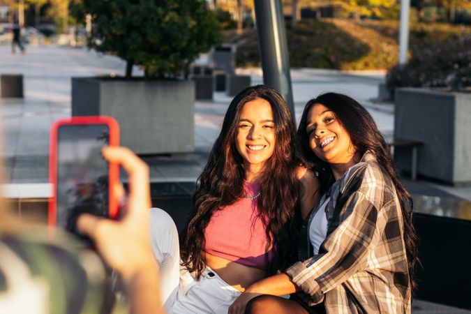 Woman taking photos of her friends