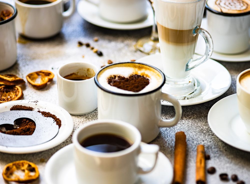 Variety of coffee drinks with heart shape topping