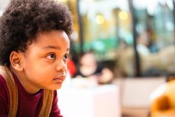 Cute boy looking to the side with copy space