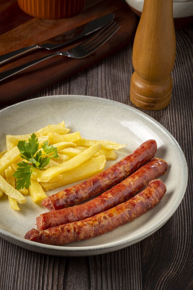 Grilled German sausage with french fries.
