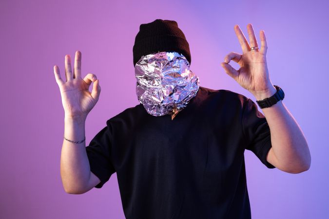 Foil mask person showing OK