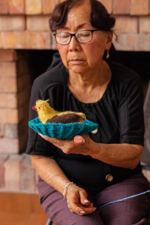 Mature woman finds solace in stitches.
