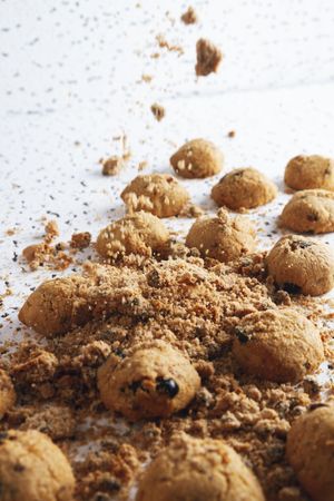 Homemade cookies with crumbs on table