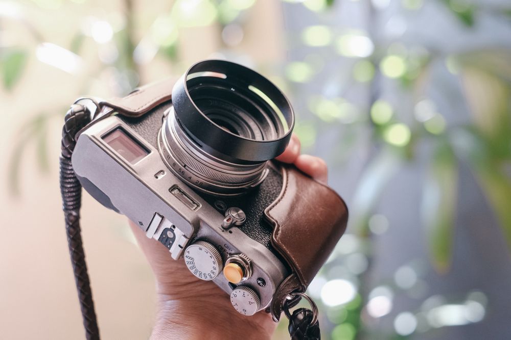 Retro camera being held by person’s hand