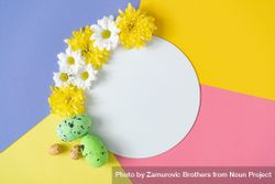 Yellow daisies and green Easter eggs on pastel background 4Zjz34