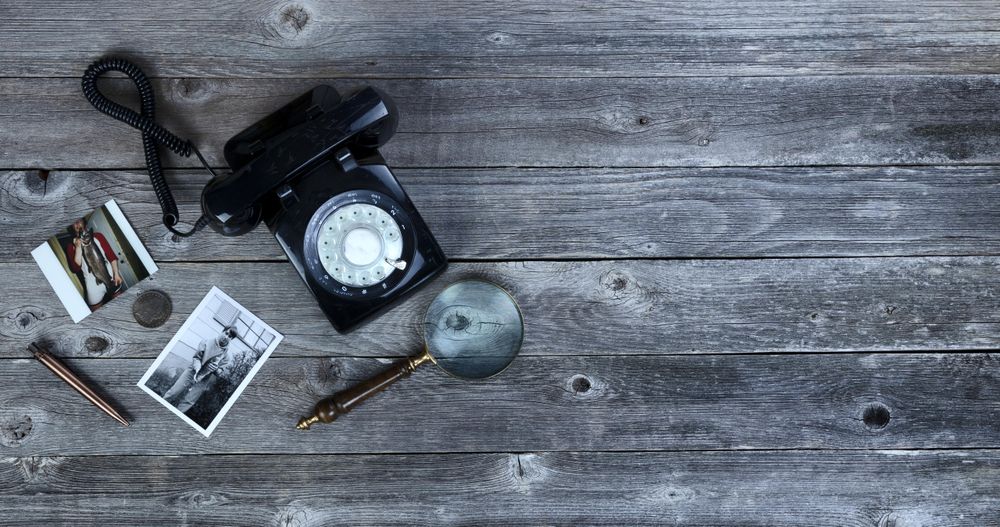 Old photos and other antiques on wood desktop