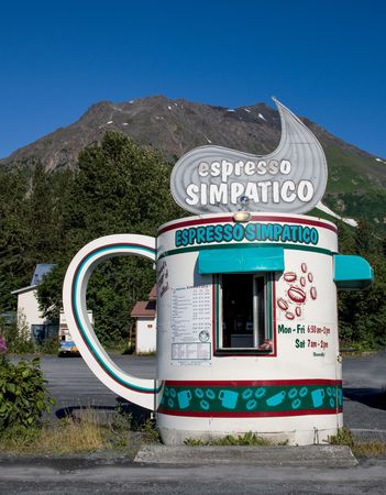 Drive-thru coffee hut in front of mountain in Alaska